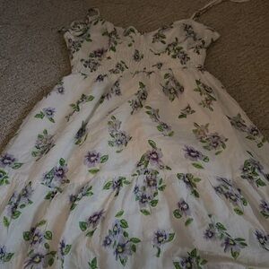 Cute spring dress with tied bows on straps and cute flower details